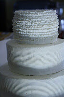 cake with ruffles being added to it