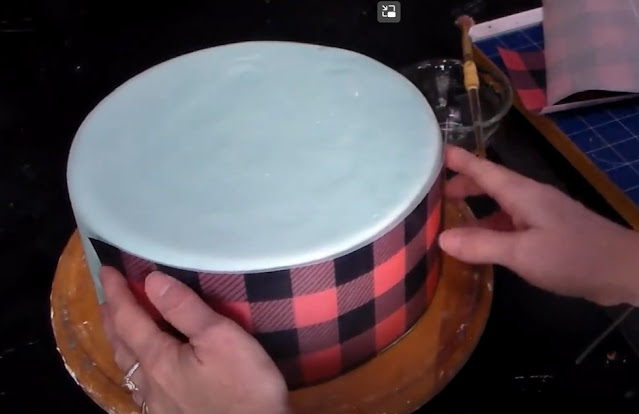 cut a piece of wafer paper to fit the cake tier