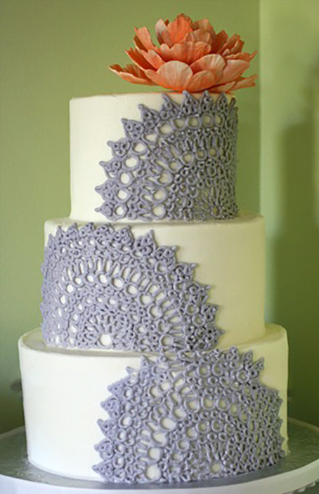 grey piped wedding cake with orange gumpaste peony