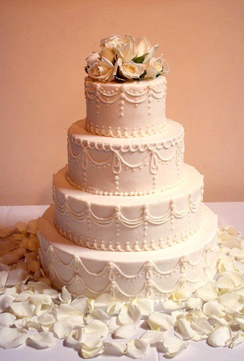 ivory piped cake with fresh roses