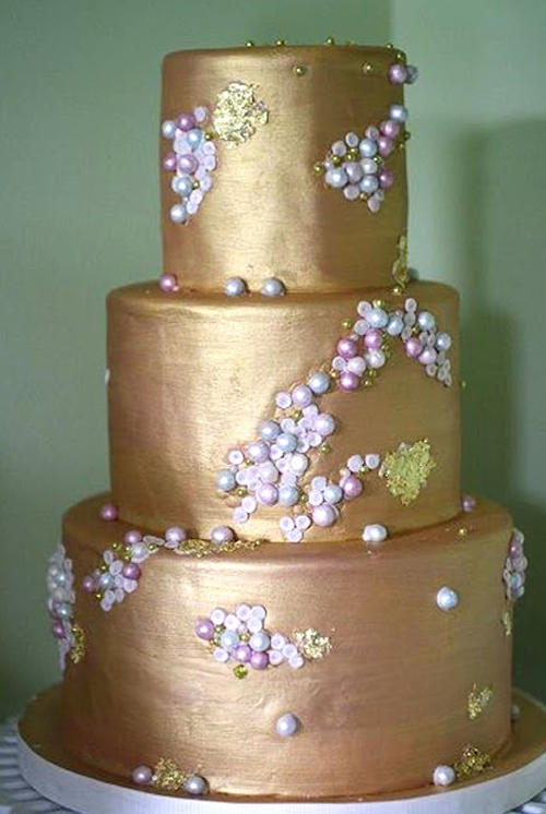 little gold wedding cake with fondant pearls and sequins
