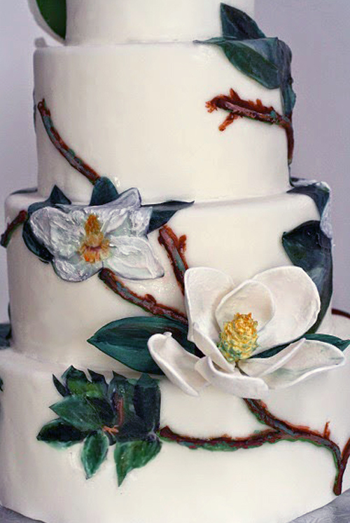 magnolia wedding cake painted flowers and gumpaste