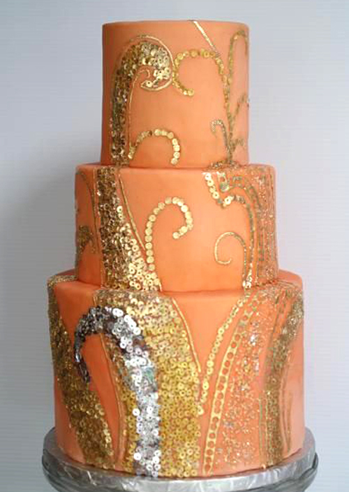 orange wedding cake with gold and silver edible sequins