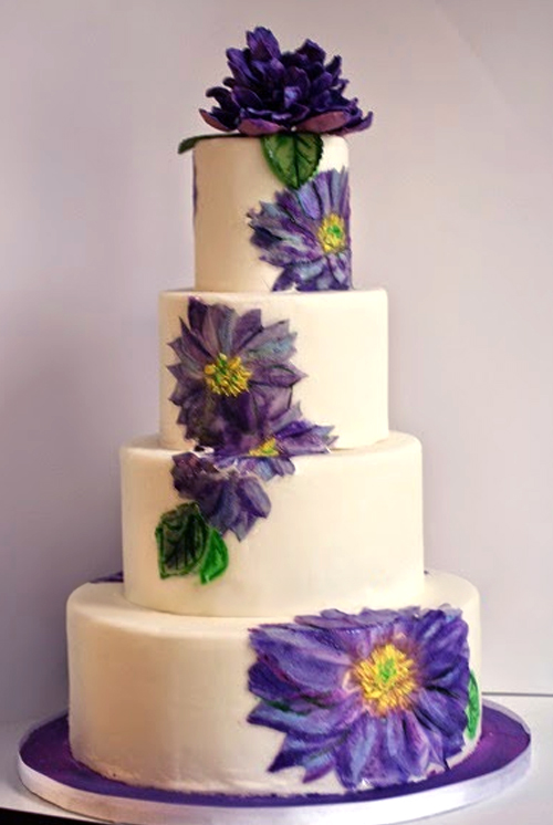 painted wedding cake with purple flowers