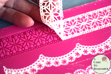 removing the cake lace from the lace mat