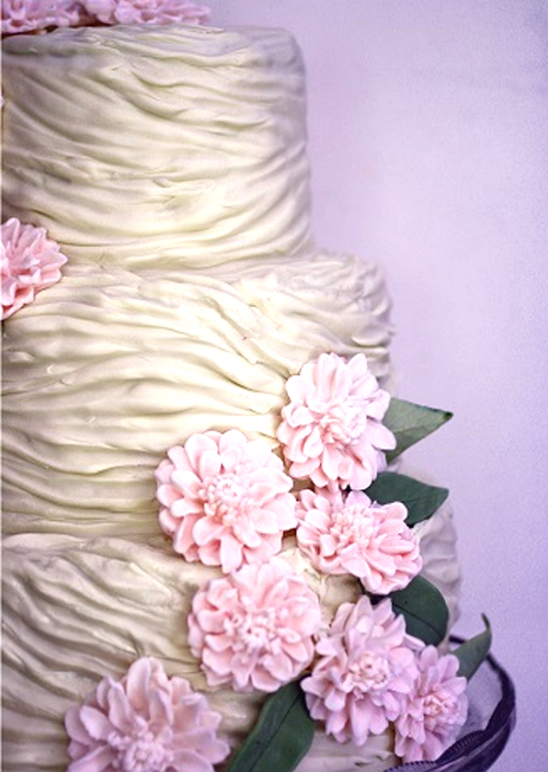 ruched fondant wedding cake with pink fondant flowers detail
