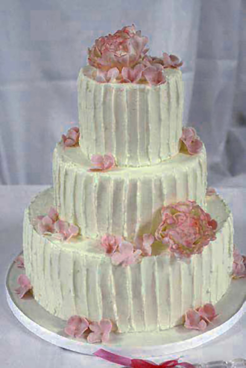 rustic wedding cake with pink gumpaste flowers