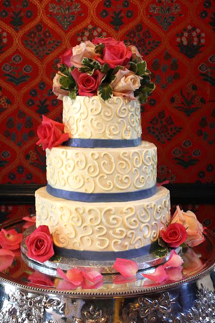 scrollwork cake blue with fresh flowers