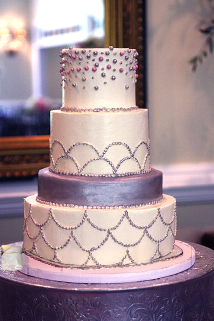 silver piped and tiers wedding cake