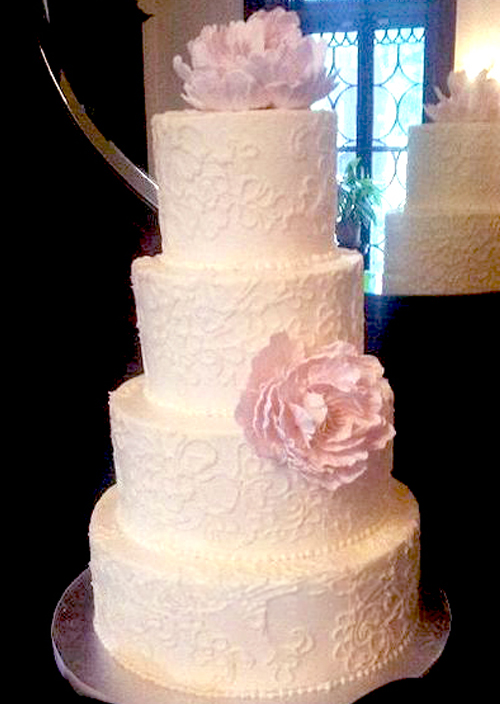 tall lace wedding cake with pink gumpaste peonies