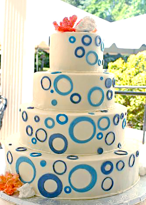 teal bubble wedding cake with range royal icing coral