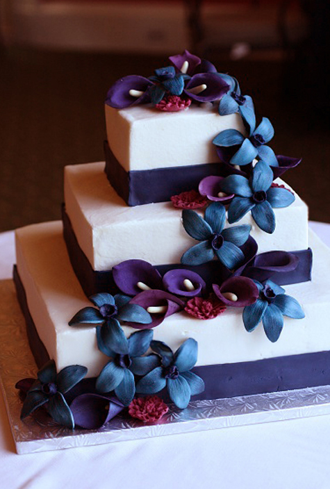 three square tiers with blue and purple gumpaste flowers