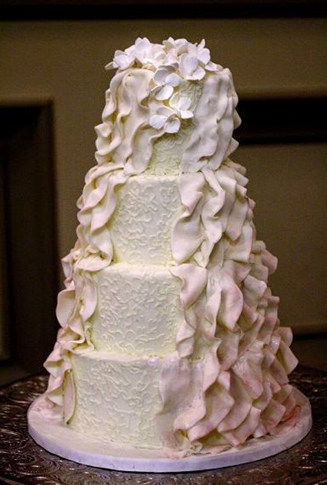 wedding cake with pink ombre ruffles cascade