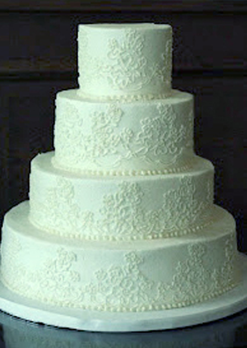 white piped lace buttercream wedding cake
