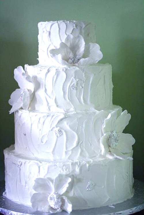 white rustic wedding cake with white fantasy flowers