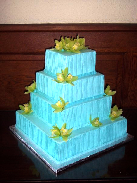 blue square tiers wedding cake with green gumpaste orchids