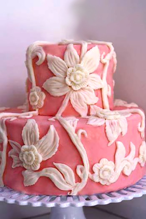 pink and cream white chocolate clay flowers cake