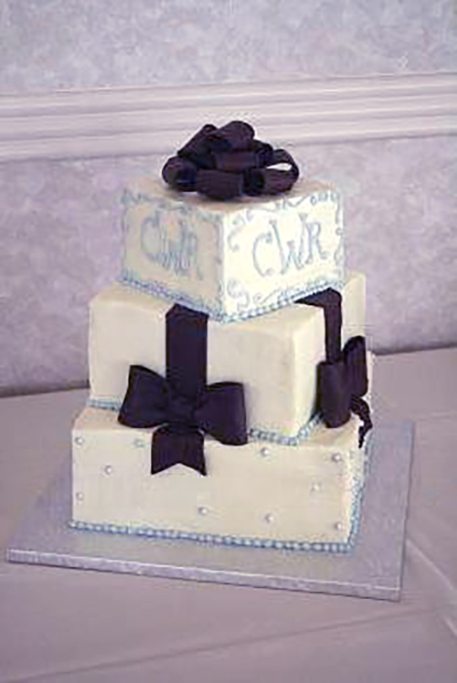 square blue and bows cake