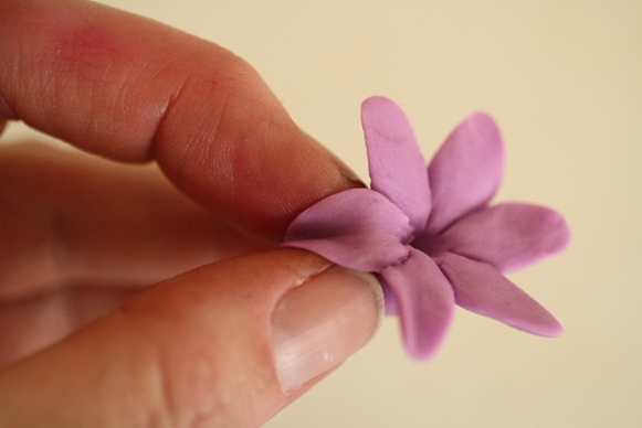 pinch the tips of the petals to curve them