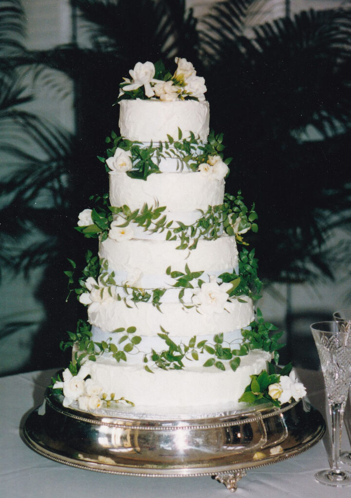 pillars wedding cake cheesecake with fresh greenery