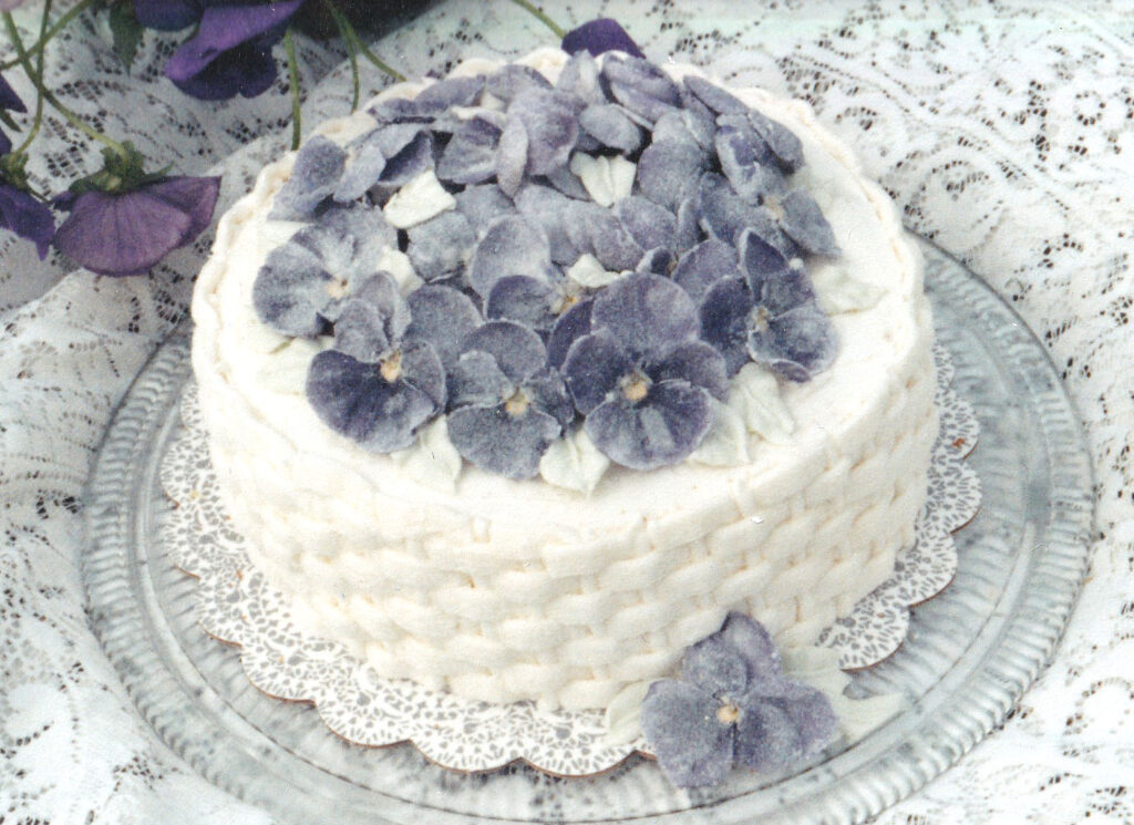 sugared pansies on a basketweave cake