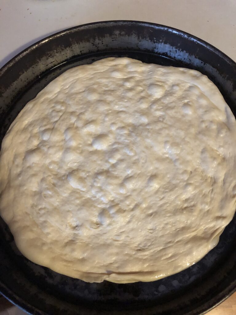 pizza dough in a pan