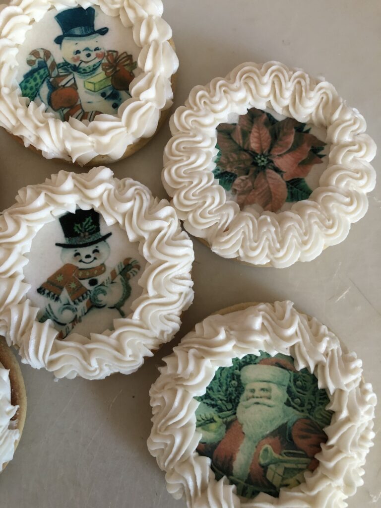 decorated cookies with wafer paper and royal icing borders