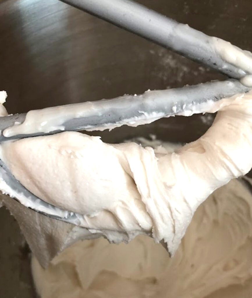 royal icing on a mixing bowl beater 