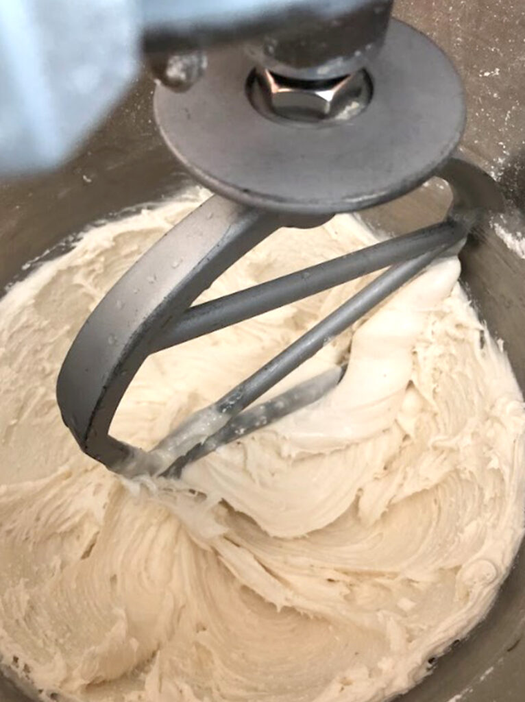 royal icing on a mixing bowl beater