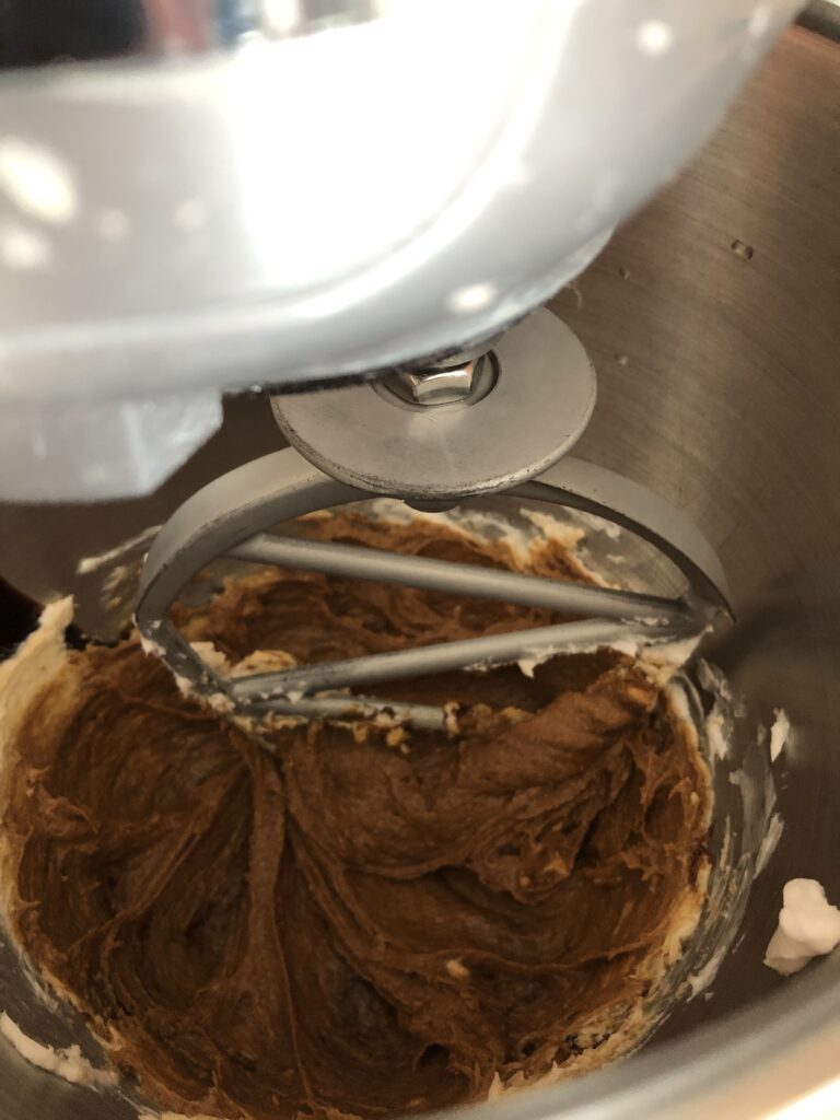 molasses cookie dough in a mixer bowl