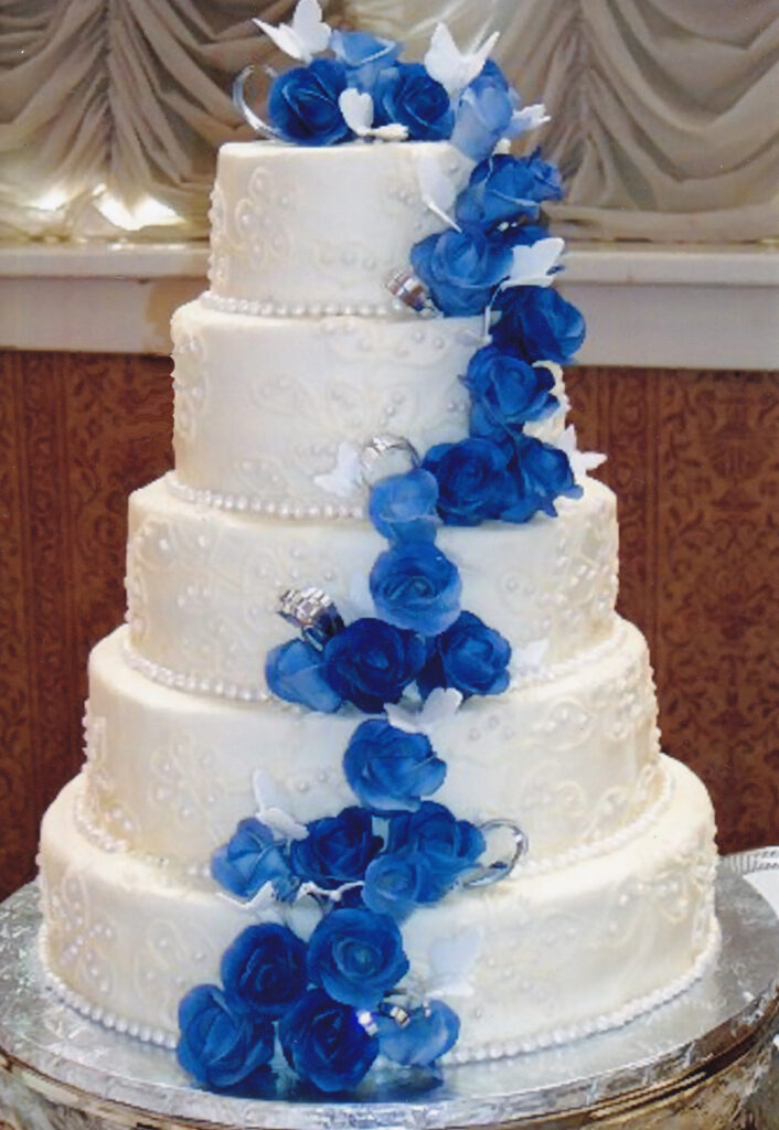 blue gumpaste roses wedding cake with silver ribbon loops