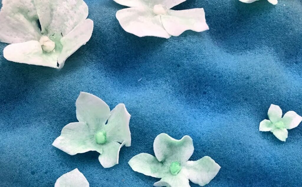 Add small wafer paper centers to the flowers if you want the dimension.