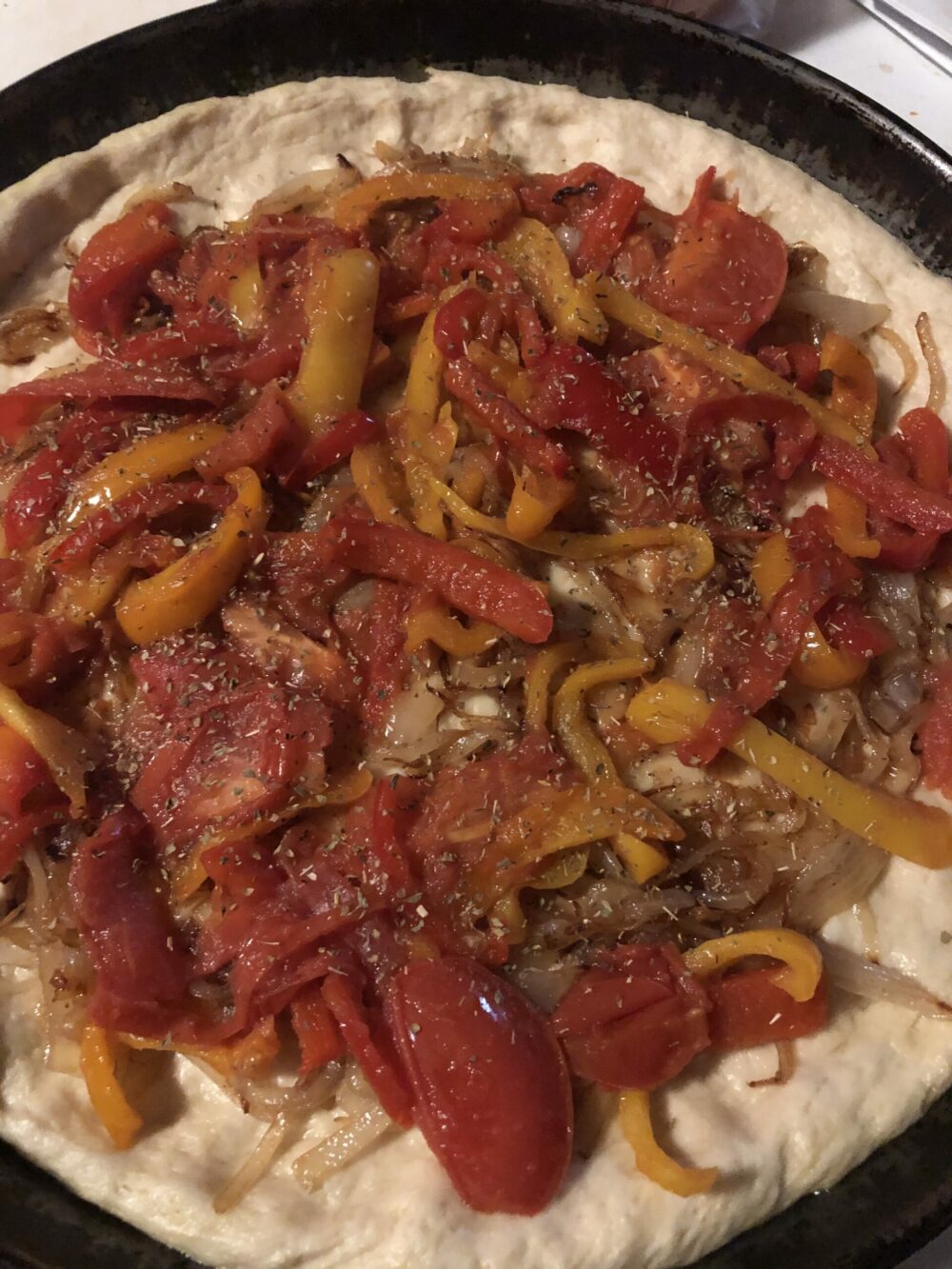 peppers and onions on the pizza dough