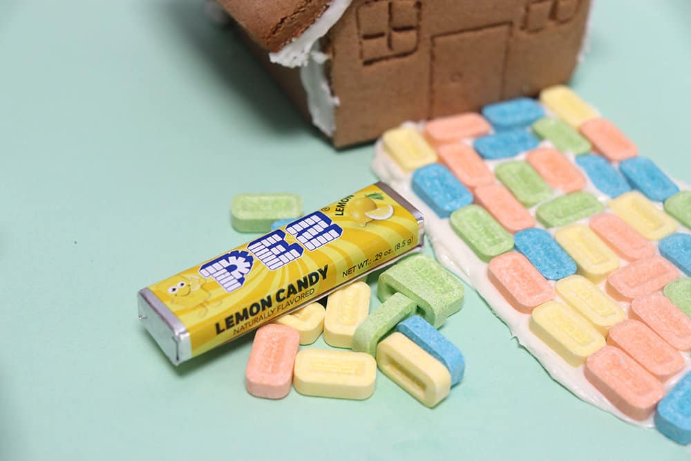 pez candy on a gingerbread house sidewalk