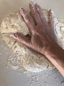 kneading the sourdough dough