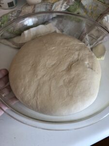 The risen dough, doubled in size