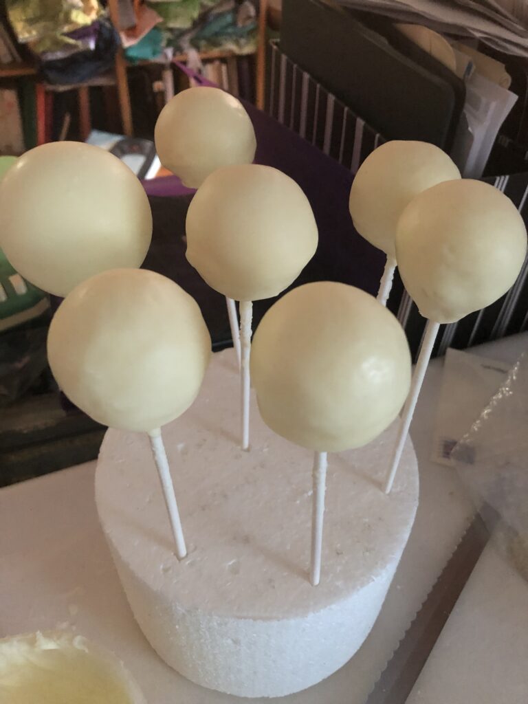 cake pops stuck into a styrofoam cake dummy