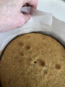 removing a cake collar from a pan