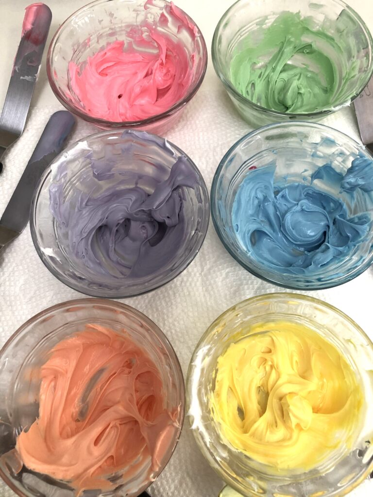 colored icing in dishes